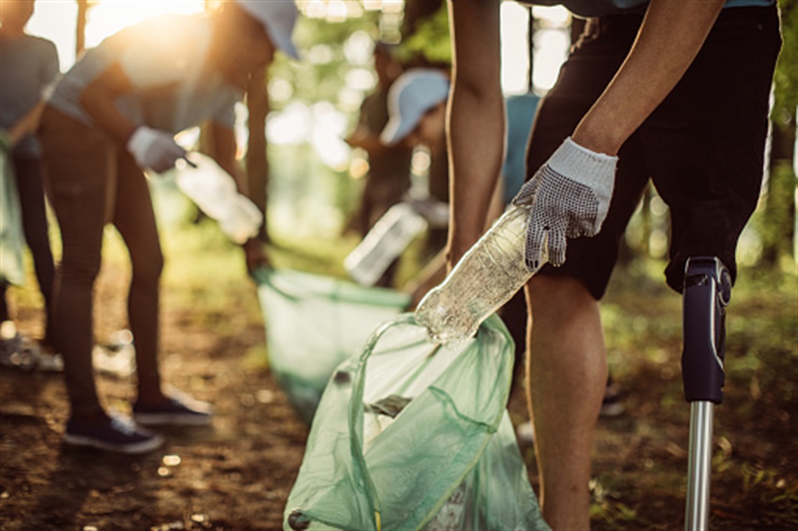 group of people cleaning up garbage