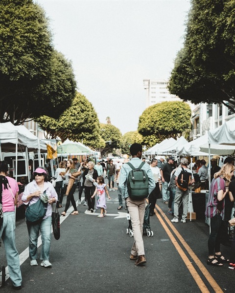 people walking in a market